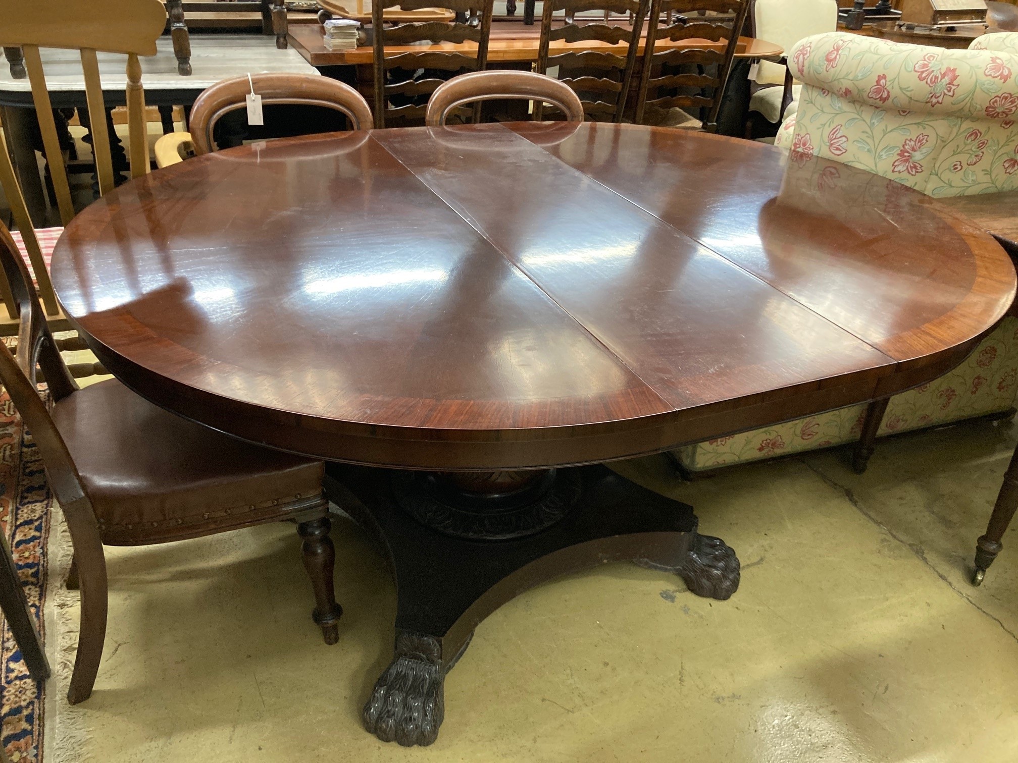 A large reproduction mahogany extending dining table, 174cm extended, width 138cm, height 77cm